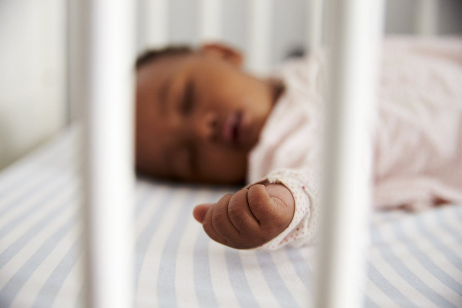 Baby sleeping in crib – Why Do Babies Cry In their Sleep Hero Image