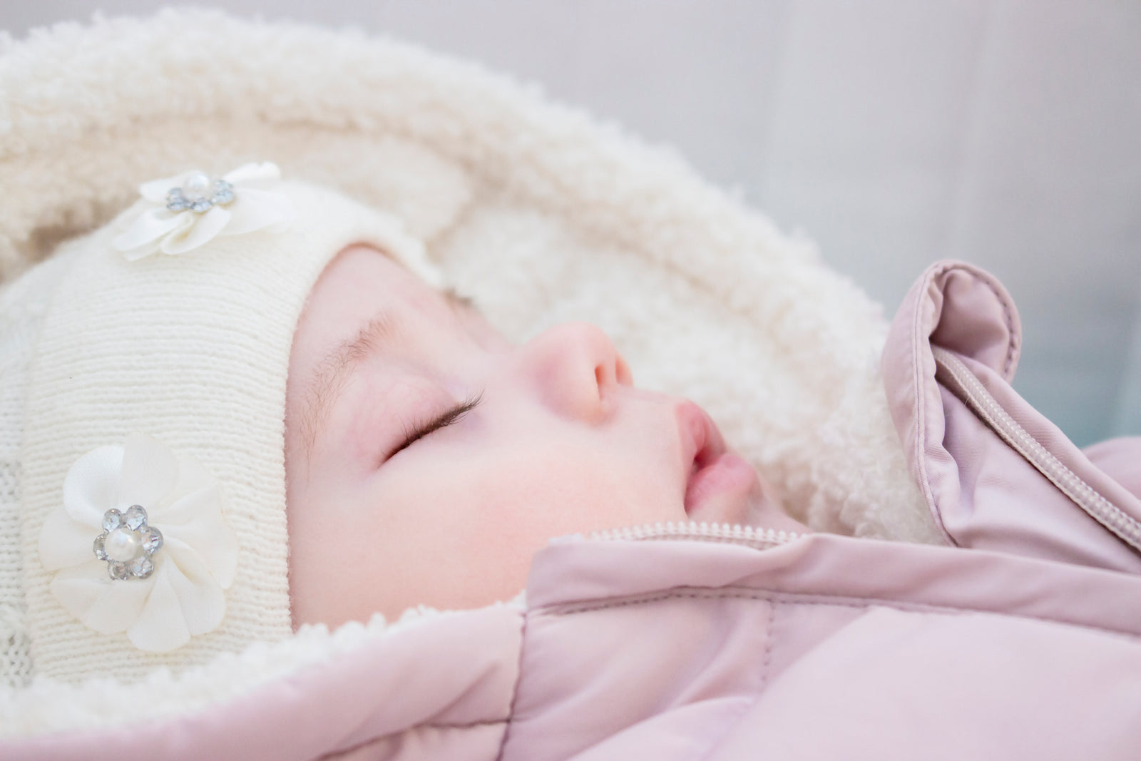 Baby in newborn baby clothes staying warm at night